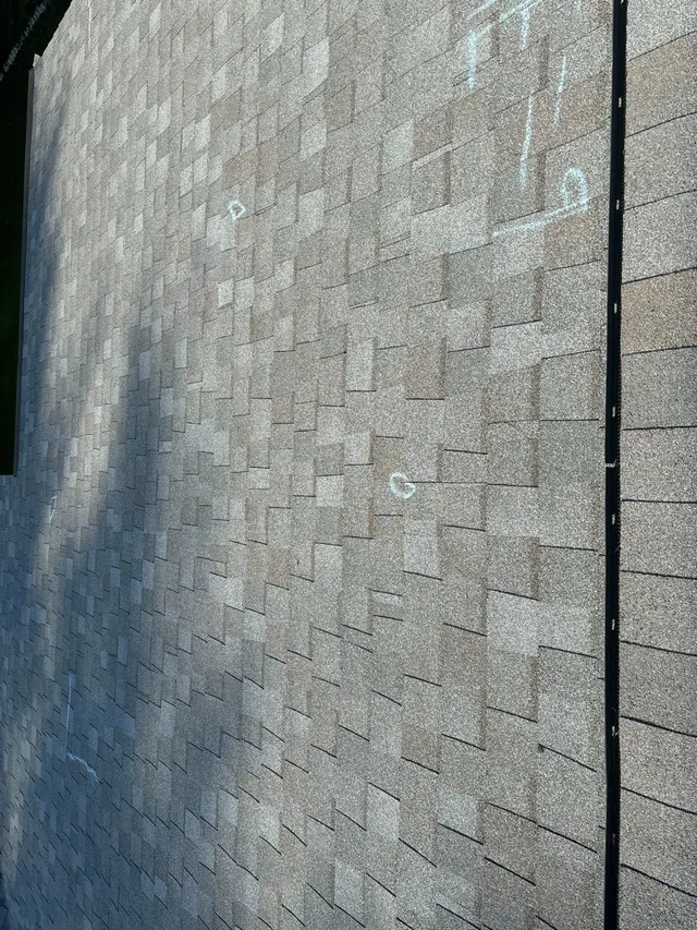 Existing roof with inspection markings on Foxpoint Drive in Maryland Heights