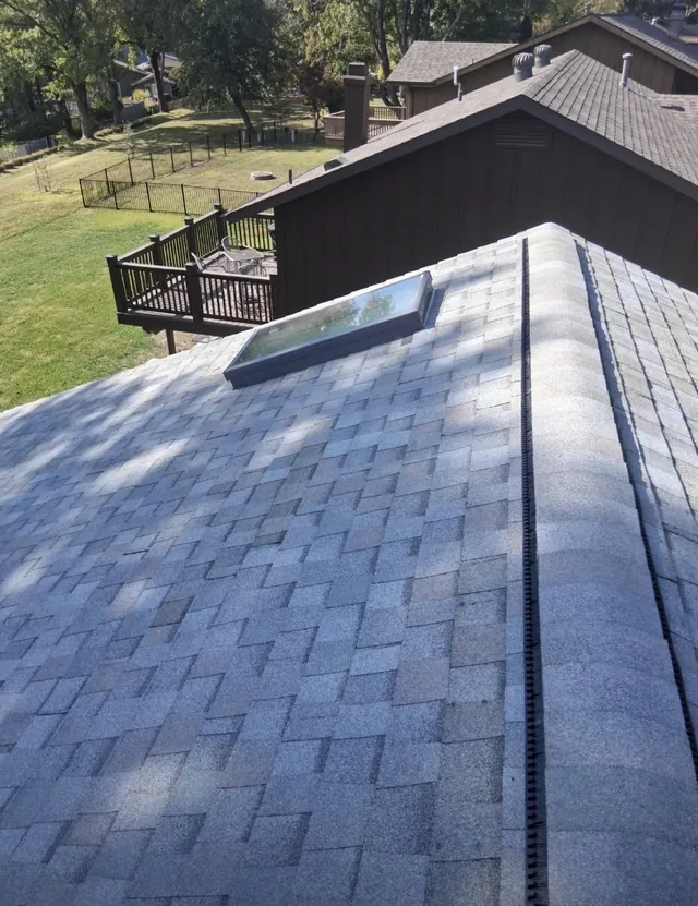 Finished shingles, skylight and ridge ventilation at the Foxpoint Drive project in Maryland Heights