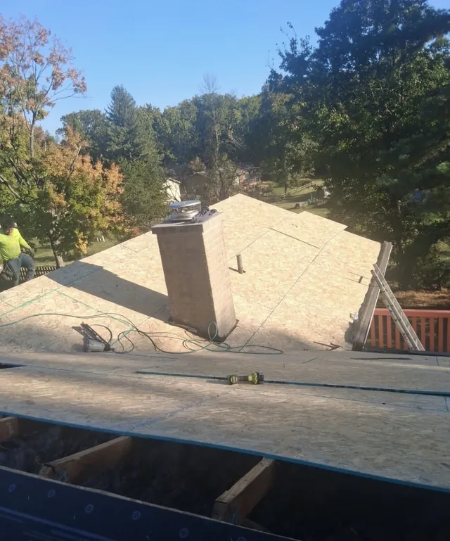 Roof deck preparation around the chimney at the Foxpoint Drive project in Maryland Heights